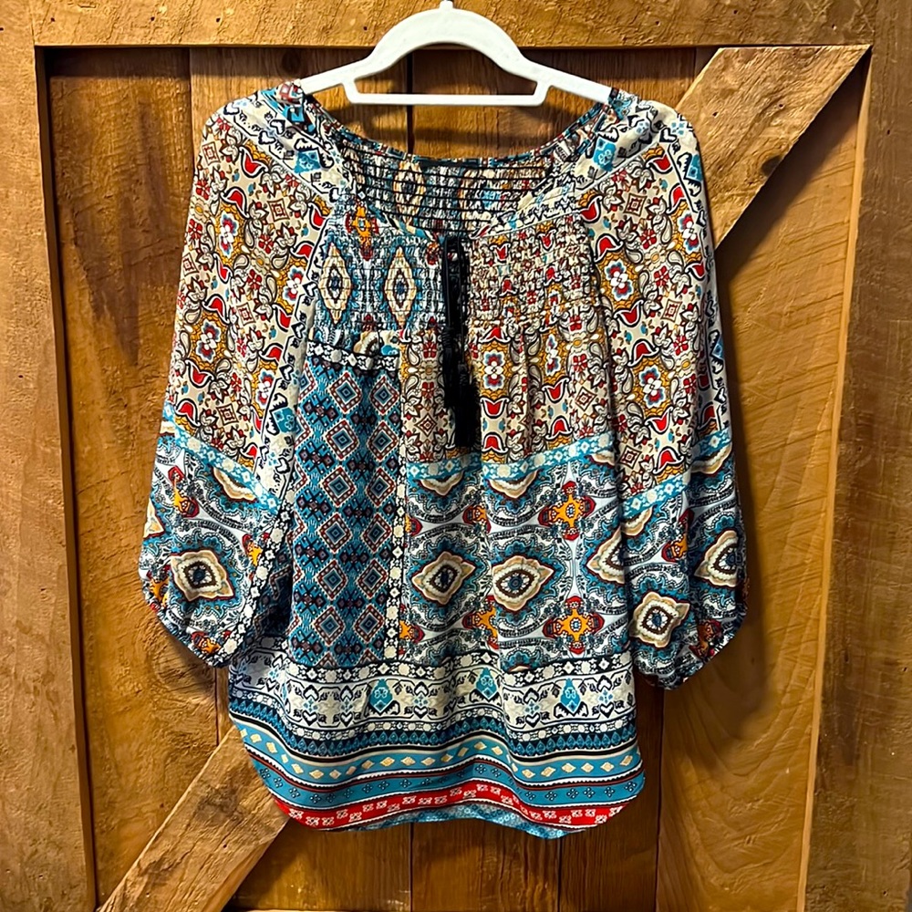 Ladies. Size L. Sheer, Boho flowing blouse that never gets wrinkled.